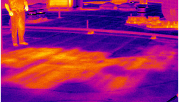 Infrared image showing on-roof moisture surveys